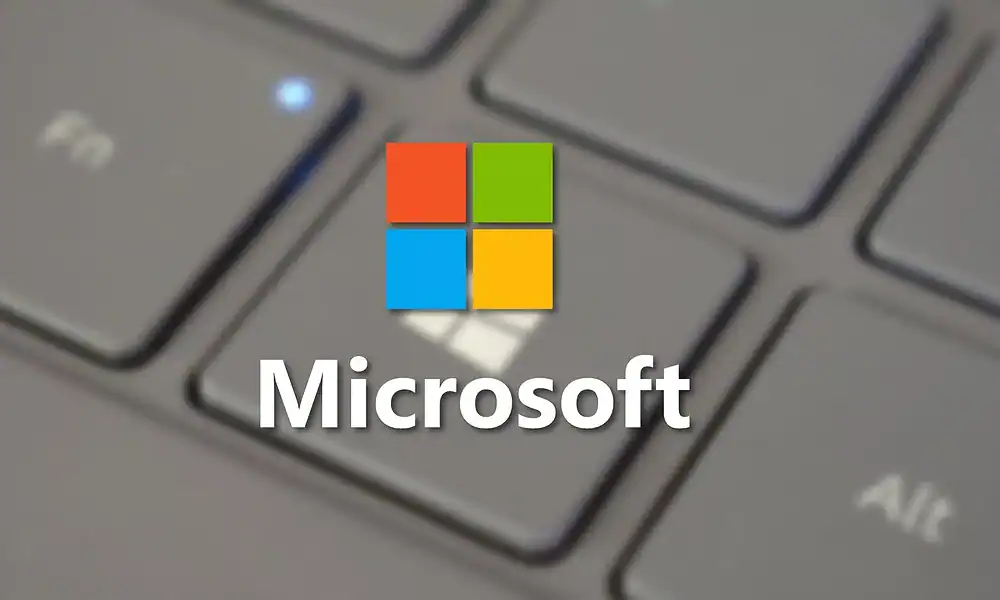 Microsoft logo over laptop keyboard 1000x600.webp.webp